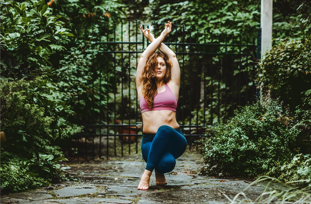 Bethany practicing yoga in the garden